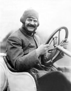 Photo: Louis Chevrolet at the wheel of a racing car in 1911. Credit: Wikimedia Commons.