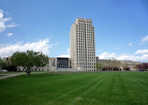 Photo: the North Dakota State Capitol, Bismarck, North Dakota. Credit: Bobak Ha'Eri; Wikimedia Commons.