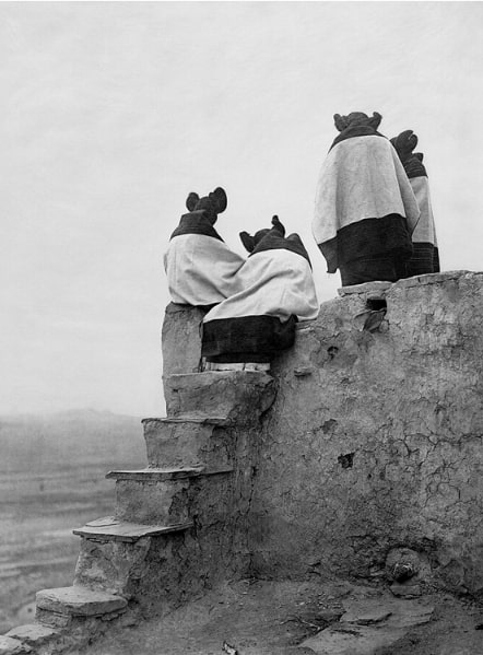 Photo: Hopi girls watching the dancers. From the Edward S. Curtis Collection, Library of Congress, Prints and Photographs Division.