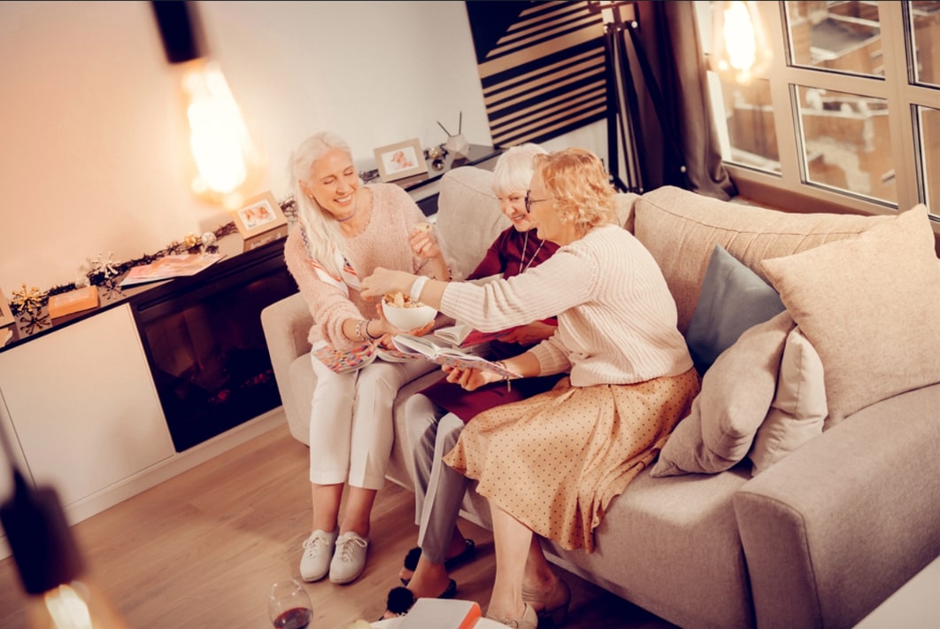 Photo: three women sharing memories.