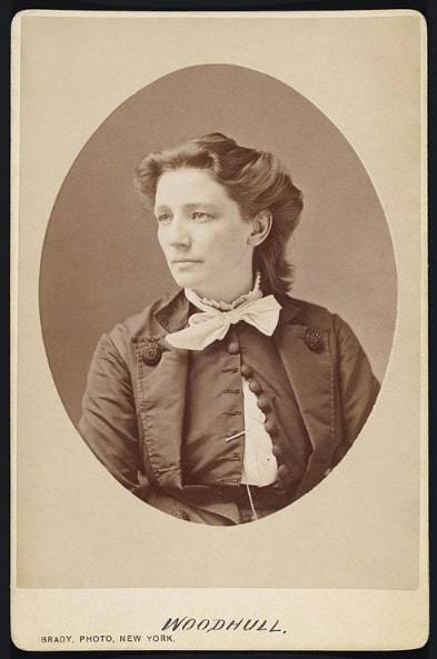 Photo: albumen silver print on cabinet card mount of Victoria Claflin Woodhull, by Mathew Brady, c. 1870. Copy from the Fine Arts Library, Harvard University, by way of the Smithsonian Institution exhibition, “Votes for Women: A Portrait of Persistence.” Credit: Google Art Project; Wikimedia Commons.