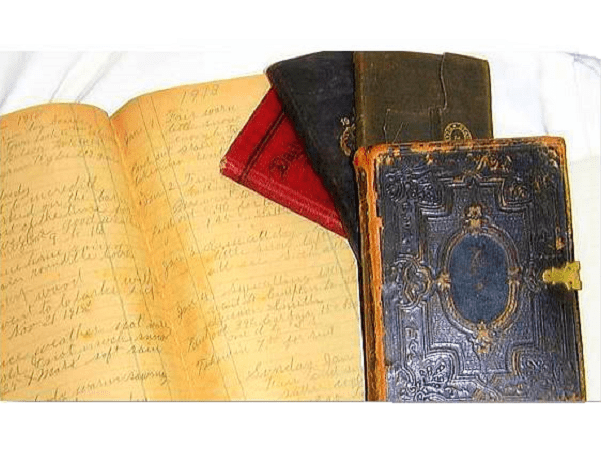 Photo: family Bible and four journals belonging to Ransom Ferdinand Smith