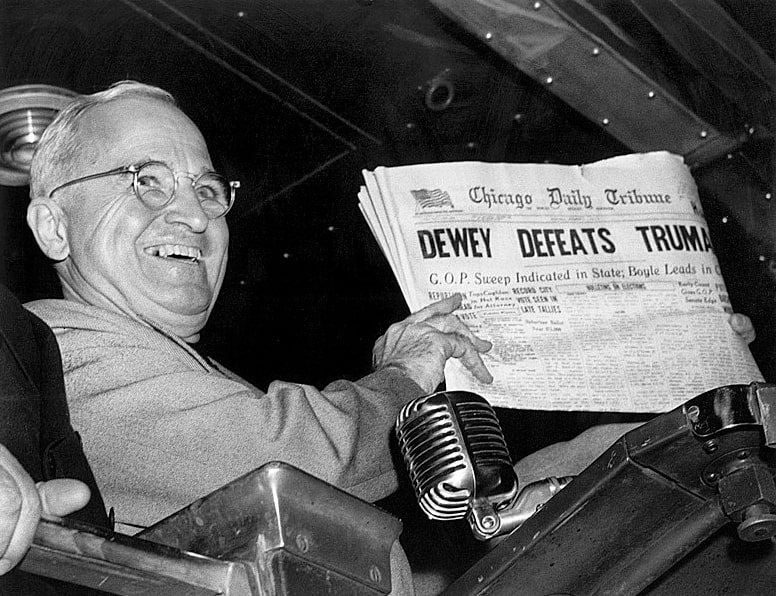 Photo: President Truman holding an early edition of the 4 November 1948 Chicago Daily Tribune showing an erroneous presidential election headline. Credit: Byron H. Rollins; Wikimedia Commons.