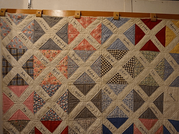 Photo: a circa 1920 friendship quilt at the Audie Murphy American Cotton Museum in Greenville, Texas. Credit: Michael Barera; Wikimedia Commons.