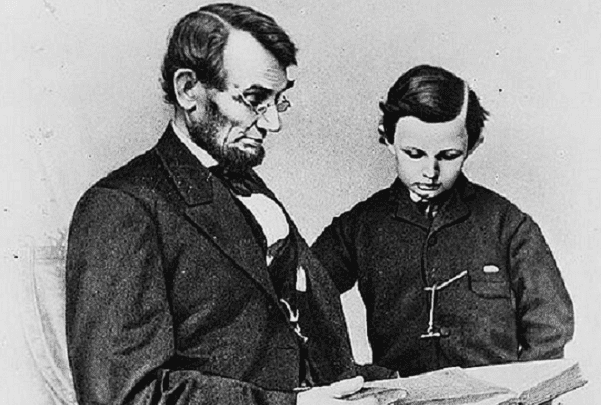 Photo: Abraham Lincoln and his son Tad looking at an album of photographs, 9 February 1864. Credit: Anthony Berger; Library of Congress, Prints and Photographs Division.