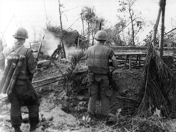 Photo: U.S. Marines move through the ruins of the hamlet of Dai Do after several days of intense fighting during the Tet Offensive. Credit: Schulimson; Wikimedia Commons.