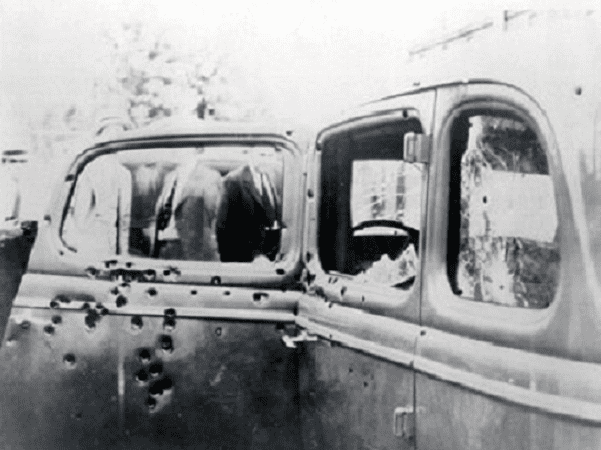 Photo: Bonnie and Clyde's car (1932 Ford V-8), riddled with bullet holes after the ambush. Picture taken by FBI investigators on 23 May 1934. Credit: FBI; Wikimedia Commons.
