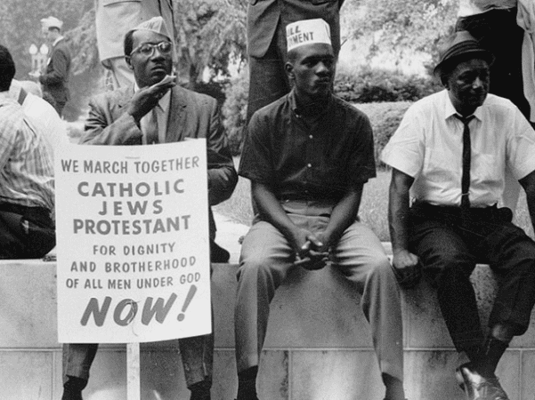 Photo: marchers resting during the Selma-to-Montgomery Civil Rights March, 21 March 1965. Credit: Library of Congress, Prints and Photographs Division.