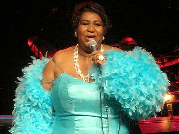 Photo: Aretha Franklin performing at the Nokia Theater in Dallas, Texas, on 21 April 2007. Credit: Ryan Arrowsmith; Wikimedia Commons.