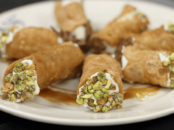 Photo: cannoli served at the Feast of the Seven Fishes, Italy. Credit: GW Fins; Wikimedia Commons.