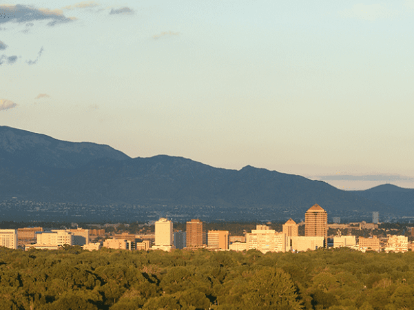 Photo: Albuquerque, New Mexico, and Sandia Mountains at sunset. Credit: Daniel Schwen; Wikimedia Commons.