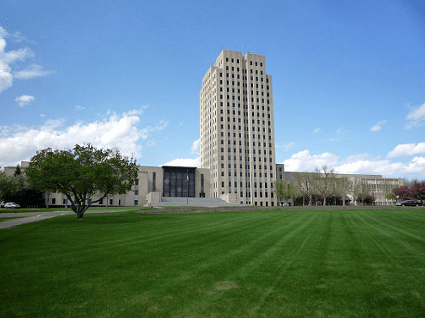 Photo: North Dakota State Capitol in Bismarck, North Dakota. Credit: Bobak Ha'Eri; Wikimedia Commons.
