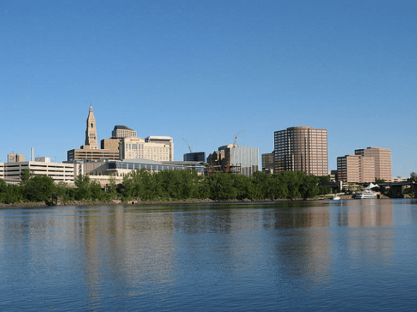 Photo: the skyline of Hartford, Connecticut, as seen from across the Connecticut River. Credit: Elipongo; Wikimedia Commons.