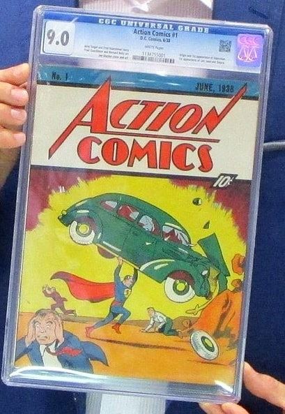 Photo: at the 2014 New York Comic Con, Vincent Zurzolo of Metropolis Collectibles displays the copy of Action Comics #1 that his firm paid $3.2 million for (cover dated June 1938 and copyrighted 18 April 1938)
