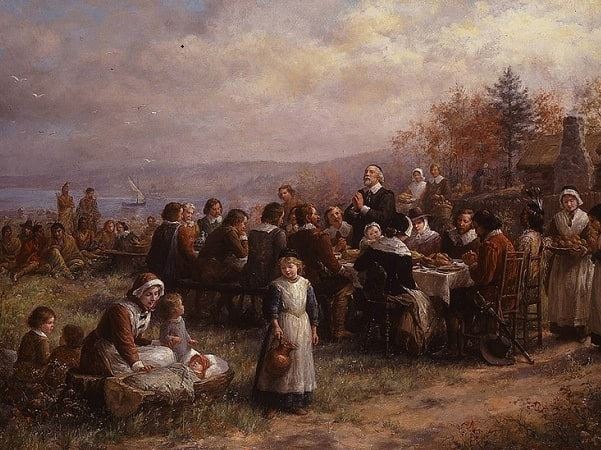 Illustration: "Thanksgiving at Plymouth," by Jennie A. Brownscombe, 1925. Credit: National Museum of Women in the Arts; Wikimedia Commons.