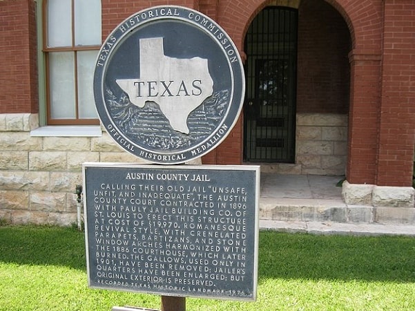 Photo: state historical marker at the old jail, Bellville, Texas. Credit: Djmaschek; Wikimedia Commons.