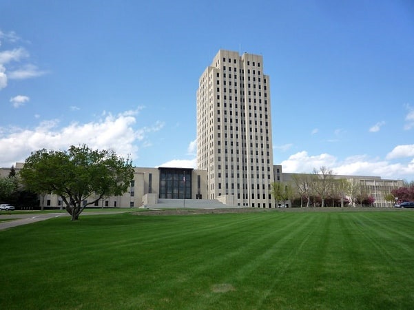 Photo: North Dakota State Capitol, Bismarck, North Dakota. Credit: Bobak Ha'Eri; Wikimedia Commons.