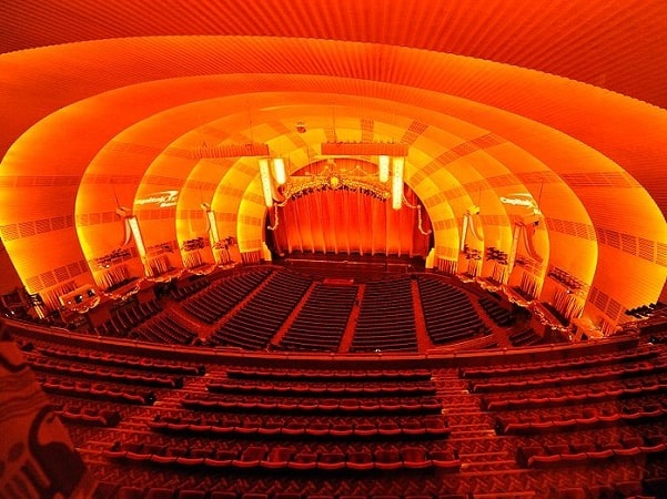 Photo: Radio City Music Hall, view of stage and orchestra seating from mezzanine seating. Credit: flickr4jazz; Wikimedia Commons.