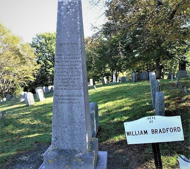 Photo: grave monument for William Bradford, governor and historian of the Pilgrims’ Plymouth Plantation, located on Burial Hill in Plymouth, Massachusetts. A Hebrew inscription reads: “Jehovah is the help of my life.” A Latin inscription on the bottom of the shaft reads: “What are Fathers with much difficulty secured do not basely relinquish.” Courtesy of Houston Baptist University Dunham Bible Museum, Houston, Texas.