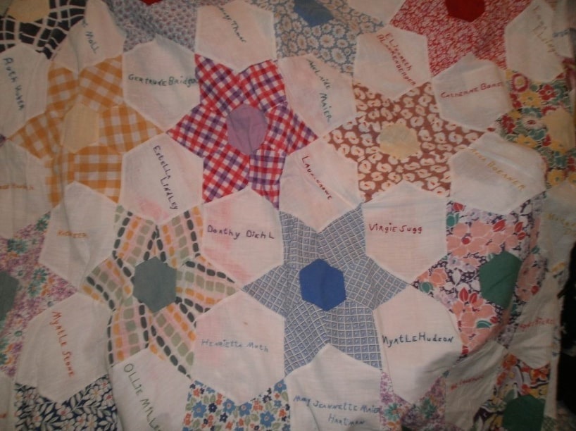 Photo: cigar girls’ quilt showing the quilters’ names. Credit: Gena Philibert-Ortega.