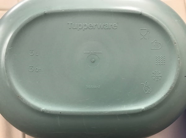 Photo: codes on the bottom of a Tupperware container