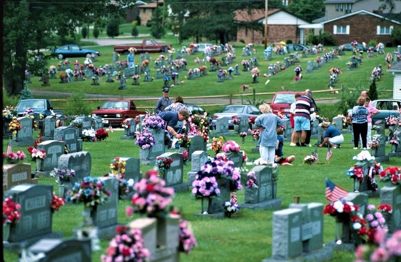 Photo: people decorating graves at Pineview Cemetery, Orgas, West Virginia, on Memorial Day weekend