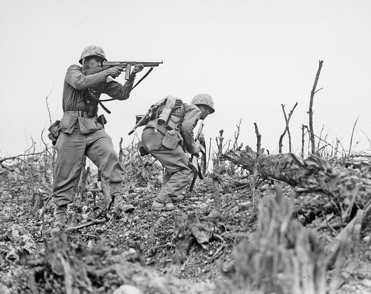 Photo: two Marines from the 2nd Battalion, 1st Marine Regiment during fighting at Wana Ridge during the Battle of Okinawa, May 1945