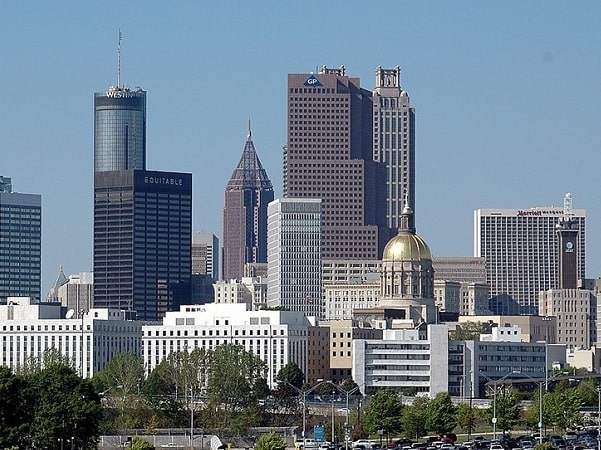 Photo: downtown Atlanta, Georgia, with the State Capitol in the foreground. Credit: Paul Brennan; Wikimedia Commons.
