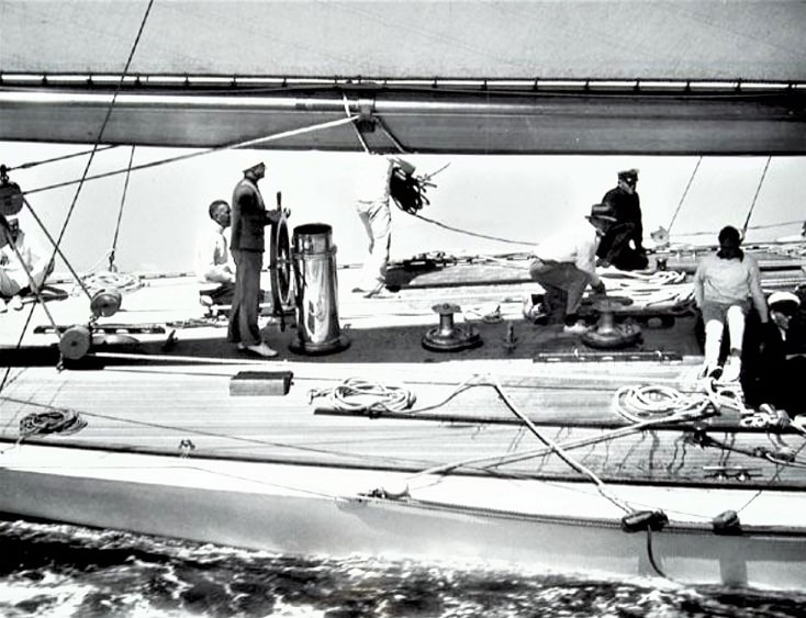 Photo: Charles Francis Adams at the helm of the “Yankee,” New York Yacht Club, 1934. Courtesy of Mystic Seaport, Rosenfeld Collection, Mystic, Connecticut. https://rosenfeld.mysticseaport.org/