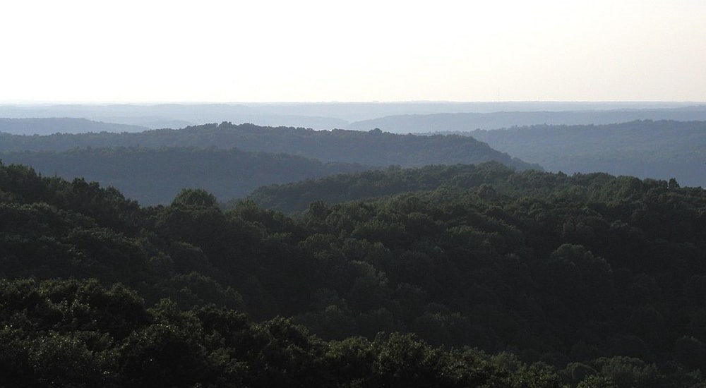 Photo: rolling hills in the Charles C. Deam Wilderness Area of Hoosier National Forest, in the Indiana Uplands. Credit: Darmon; Wikimedia Commons.