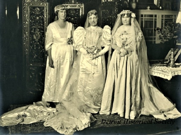 Photo: group portrait of (left to right) Helen Bourne Joy Lee, Helen Hall Newberry, and Edith Stanton Newberry at the 30th wedding anniversary dinner of Helen Hall Newberry Joy and Henry Bourne Joy, Sr. Edith wears the wedding dress of her mother-in-law Helen P. Newberry. Courtesy of the Detroit Historical Society.