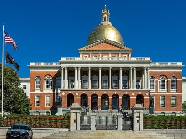 Photo: the Massachusetts State House, topped by its golden dome, faces Boston Common on Beacon Hill, Boston. Credit: Ajay Suresh; Wikimedia Commons.
