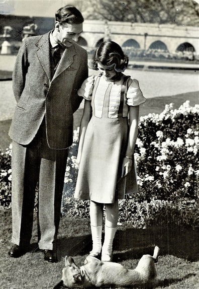 Photo: His Majesty King George VI with the heir-presumptive, Princess Elizabeth. The dog at their feet is the favorite pet of the royal family; an aged Welsh Corgi named. Dookie, 1939. Toronto Star Archives, London. Courtesy of Toronto Public Library, Special Collections Archives.