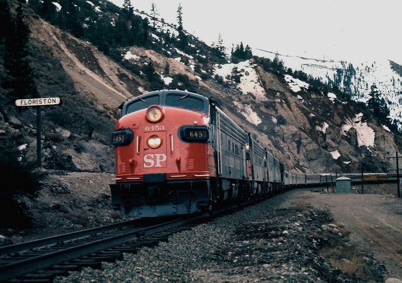 Photo: a Southern Pacific EMD FP7 locomotive leads a Pacific Rail Society Special through Floriston, California, in February 1971. Credit: Drew Jacksich; Wikimedia Commons.