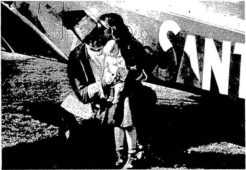Photo of Edward Snow delivering a doll, Newark Star-Ledger newspaper article 15 December 1948