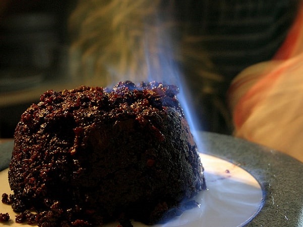 Photo: a Christmas pudding being flamed after brandy has been poured over it. Credit: Matt Riggott; Wikimedia Commons.