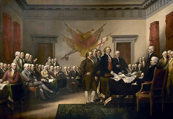 Illustration: John Trumbull's famous 1818 portrait is often identified as a depiction of the Declaration's signing, but it actually shows the drafting committee presenting its work to the Second Continental Congress on 28 June 1776. Thomas Jefferson, at center, places the document before the president of the Congress, John Hancock. Standing with Jefferson are other members of the drafting committee: John Adams, Roger Sherman, Robert Livingston, and Benjamin Franklin. Less than a week later, on 4 July 1776, the declaration was signed. Note: Not all 56 signers are included in this picture. Credit: Wikimedia Commons.