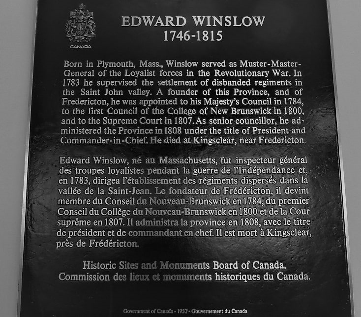 Photo: historical marker for Edward Winslow. The plaque is on the wall on the first floor, inside the Harriet Irving Library, University of New Brunswick, Canada. Credit: University of New Brunswick.