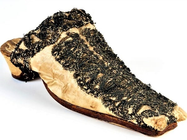 Photo: Penelope Pelham Winslow’s embroidered silk shoe, thought to have been worn by Penelope Pelham at her wedding to Josiah Winslow in 1651. Courtesy of Pilgrim Hall Museum.