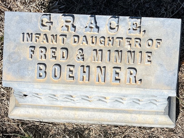 Photo: white bronze graver marker, Arapahoe Cemetery, Nebraska. Credit: Gena Philibert-Ortega.