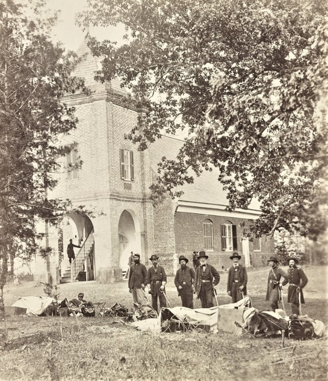 Photo: Saint Peter’s Church, Virginia (the church in which George Washington was married). Left to right: Maj. A. M. Clark, volunteer A.D.C.; Lt. Col. J. H. Taylor, A.G.; Capt. F. N. Clarke, Chief of Arty.; General E. V. Sumner; Lt. Col. J. F. Hammond, Medical Director; Capt. Pease, Minnesota Vols., Chief of Commissary; Capt. Gabriel Grant. Credit: Library of Congress, Prints and Photographs Division.