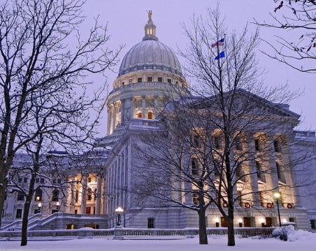 Photo: the Wisconsin State Capitol is located on the isthmus between Lake Mendota and Lake Monona, in the city of Madison, Wisconsin. Credit: RAHurd; Wikimedia Commons.