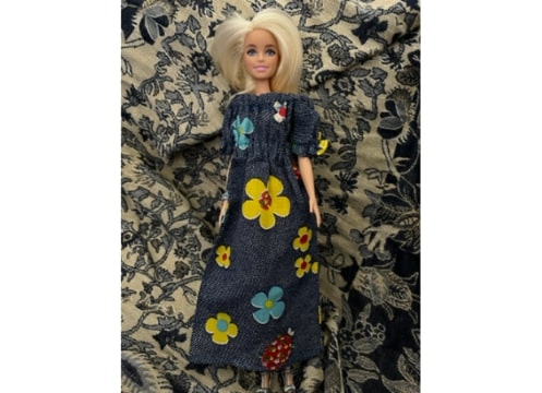 Photo: Barbie in a flower dress made by the author’s mother and grandmother. Credit: Gena Philibert-Ortega.