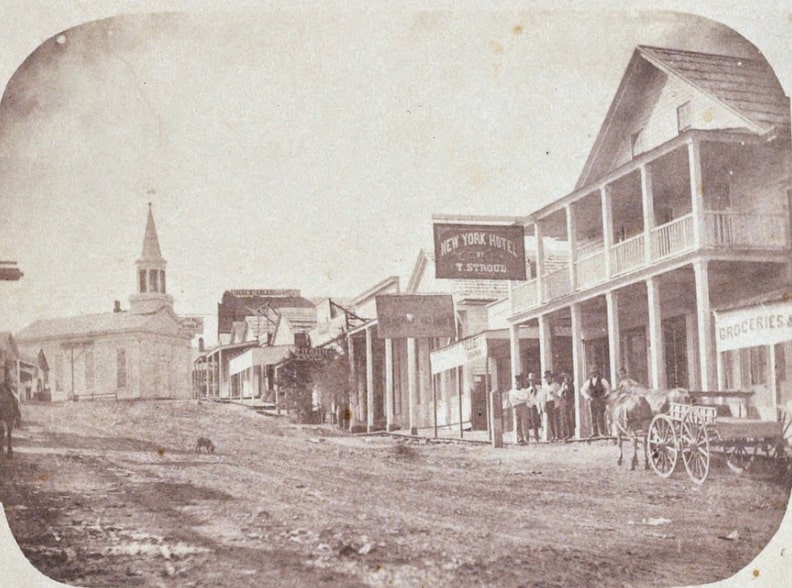 Photo: Nevada City, California, c. 1856. Credit: Julia Ann Rudolf; Nevada Mining History; Wikimedia Commons.