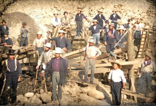 Photo: 1852 image of 23 miners at a California placer operation (colorized). Credit: Western Mining History.
