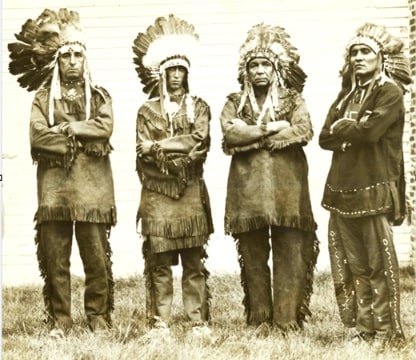 Photo: members of the Wampanoag Nation who gathered for the three-day powwow of their tribes at Mashpee, Massachusetts, in 1929. Left to right: Chief Standing Rock of the Herring Pond Tribe; Chief Red Shell of the Wampanoags; Chief Small Bear of the Mashpee Tribe; and Chief High Eagle, medicine man of the Wampanoags. Credit: Boston Public Library Digital Commonwealth.