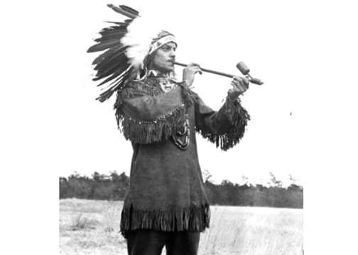 Photo: Clinton Mye Haynes (Chief Wildhorse) of the Mashpee Wampanoag Tribe smoking a pipe. Credit: William Brewster Nickerson Cape Cod History Archives, Cape Cod Community College, West Barnstable, Massachusetts.