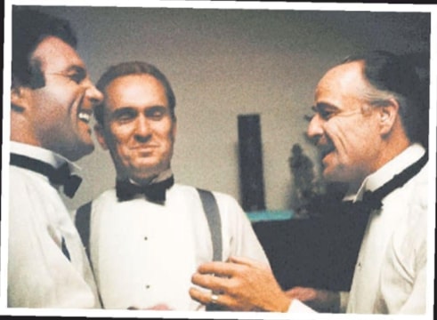 Photo caption: James Caan, Robert Duvall, and Marlon Brando clown around. Duvall and Brando had an ongoing mooning contest. New York Post (New York, New York), 14 December 2008, page 72.