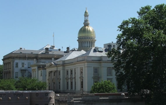 Photo: the New Jersey State House in Trenton, New Jersey. The design of the dome-capped New Jersey State House differs from most other U.S. state houses in not resembling the U.S. Capitol. Credit: Marion Touvel; Wikimedia Commons.