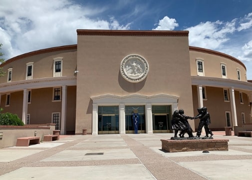 Photo: the New Mexico State Capitol in Santa Fe, New Mexico. Credit: F. McGady; Wikimedia Commons.